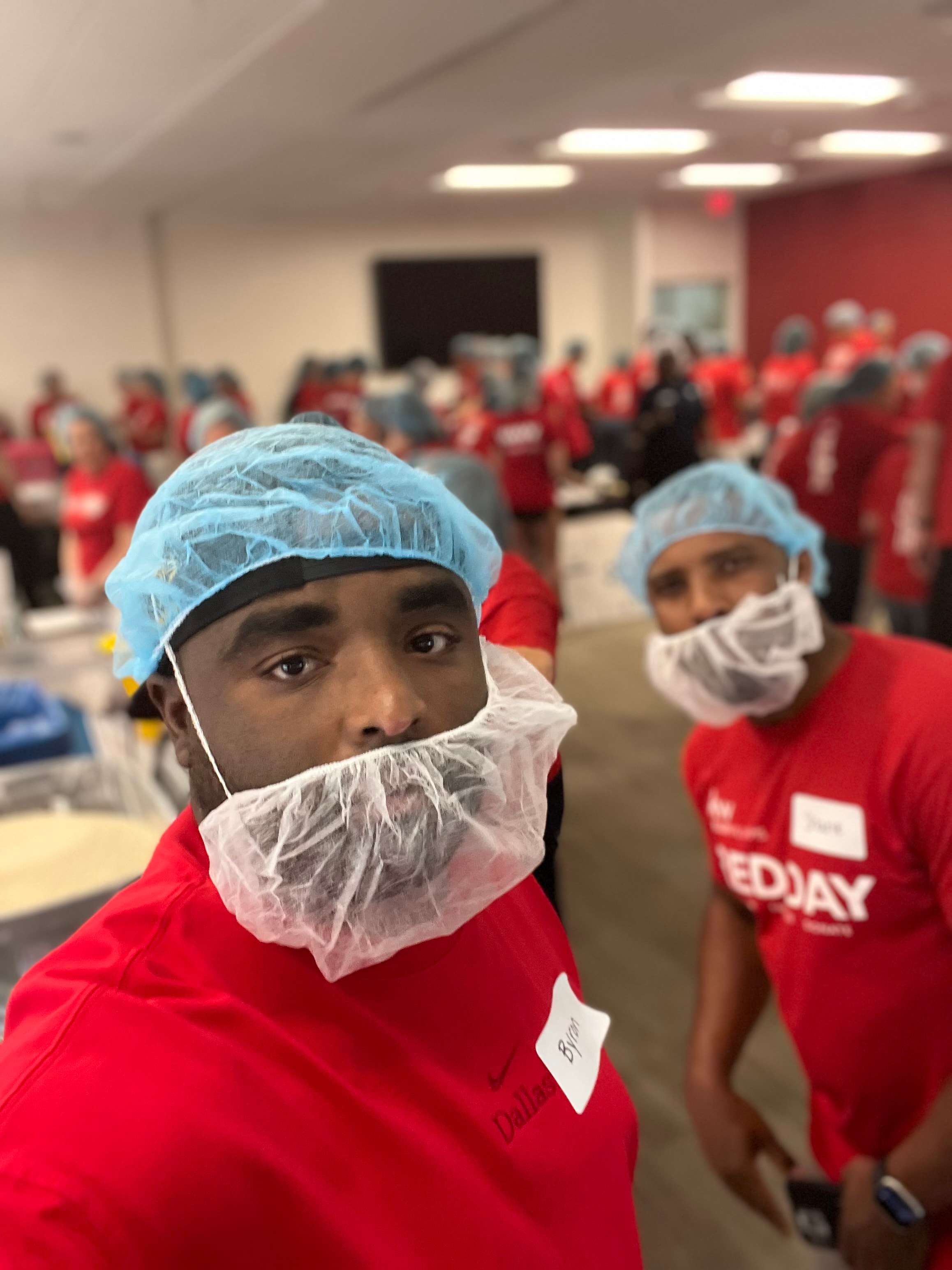 Byron Haynes volunteering at a community Red Day service event